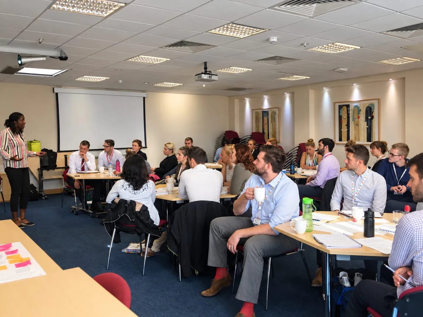Lorraine leading a training session for a room of school staff